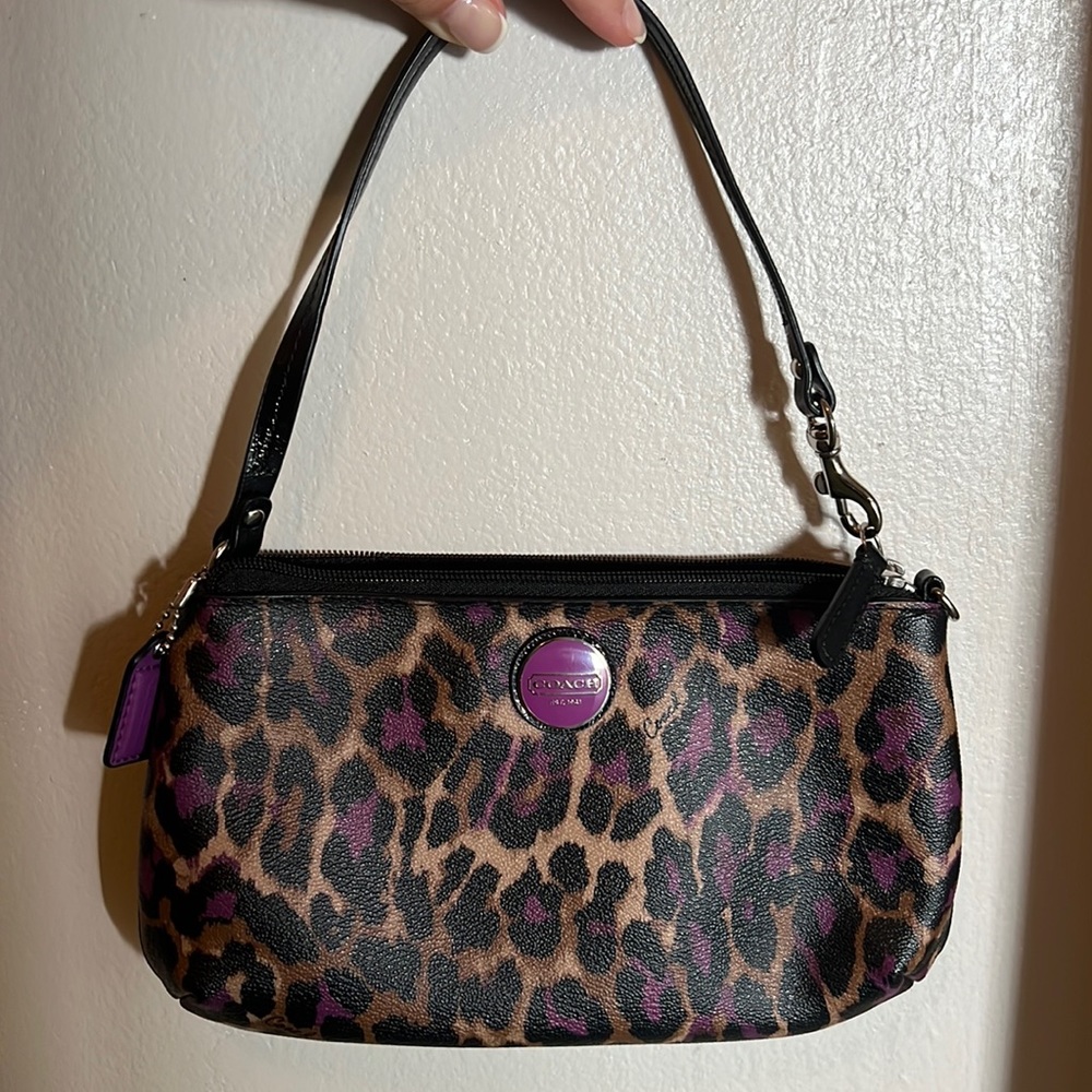 Coach hand purse. Cheetah with purple accents.